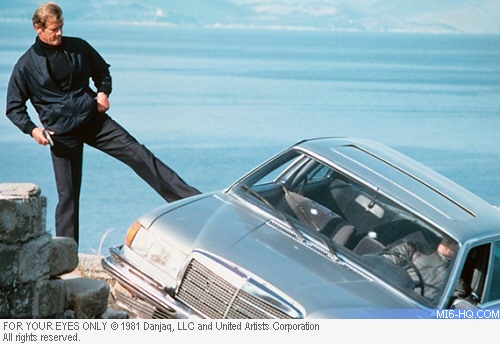 James Bond kicks Locque's car over a cliff